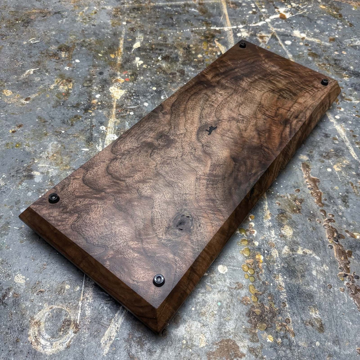 bottom view of quilted walnut figure and surface finish