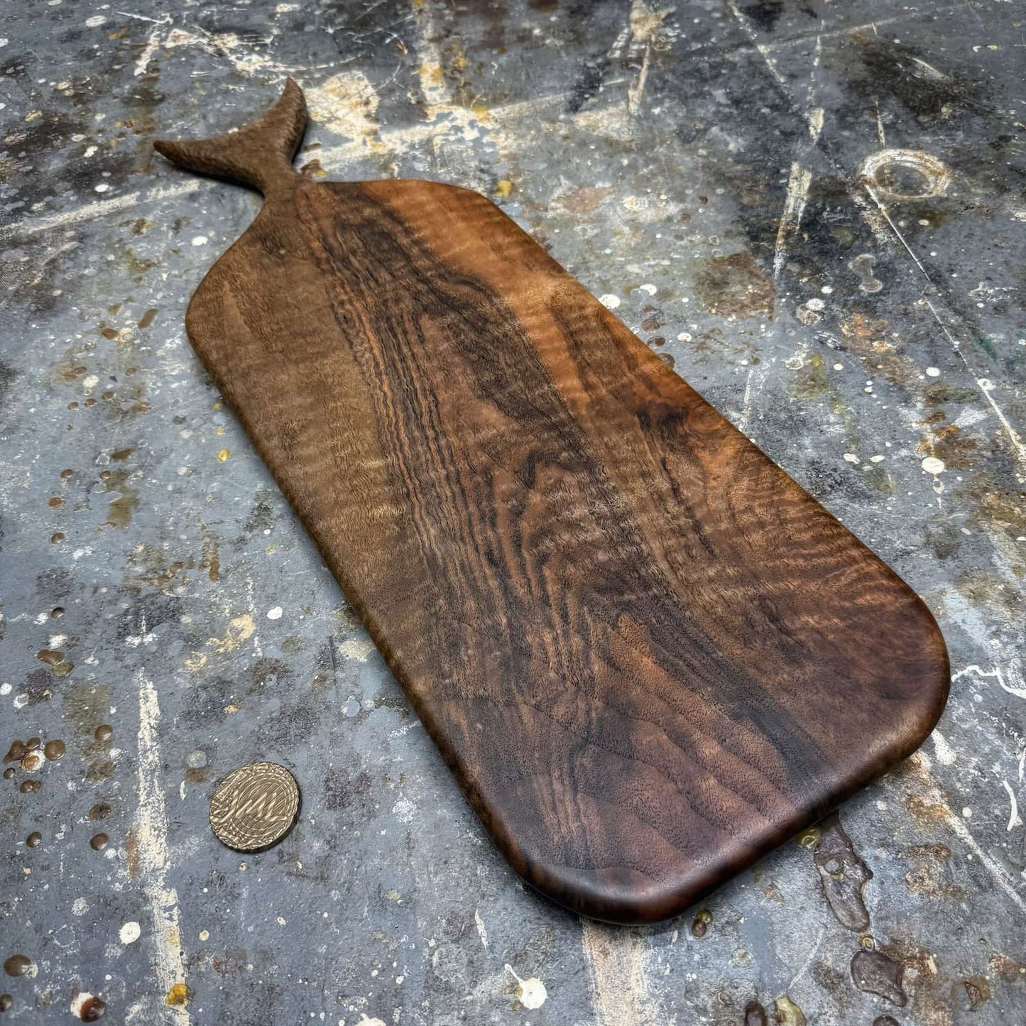 overhead view of english walnut board and sculpted handle