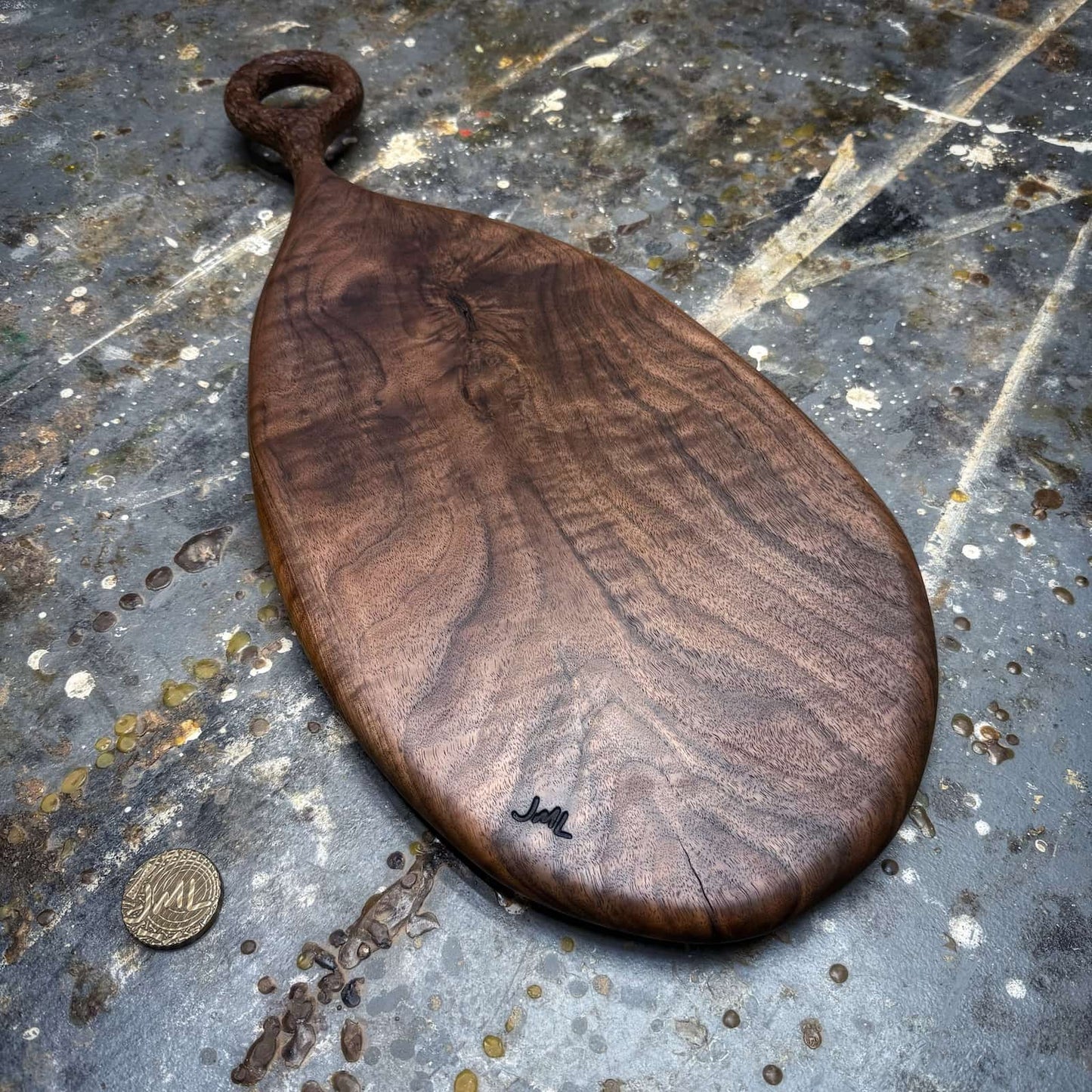 finished walnut serving board showing depth and figure in the wood