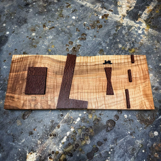 Angled view of curly maple inlay jig with leopardwood components