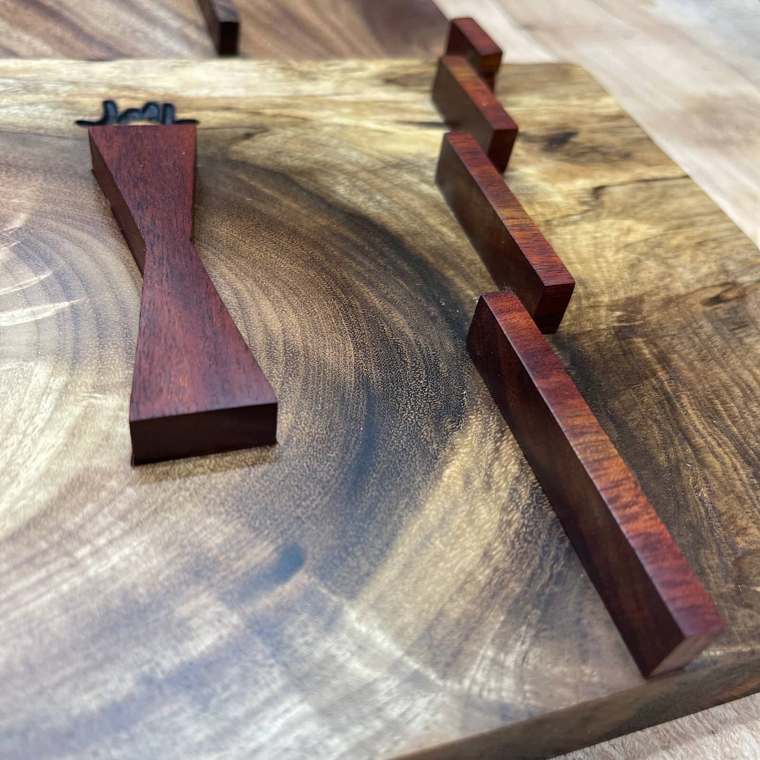 detailed view of a handcrafted hardwood inlay jig showing clean alignment guides, smooth surfaces, and precise craftsmanship by JML Woodcraft