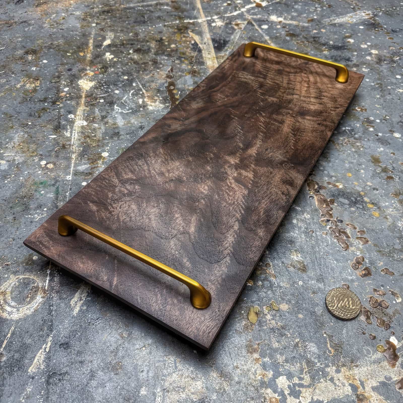 angled view showing beveled sides and gold hardware