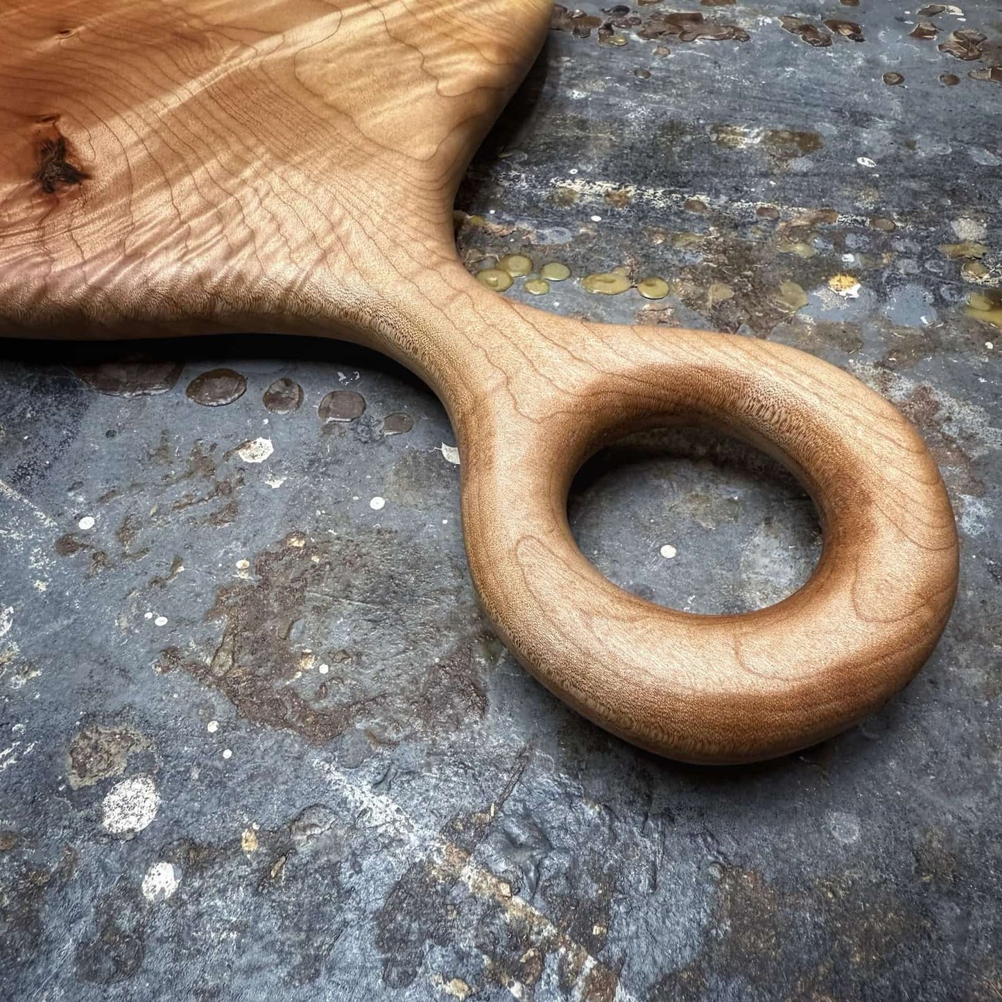 detail of handle curvature and tight curl in maple