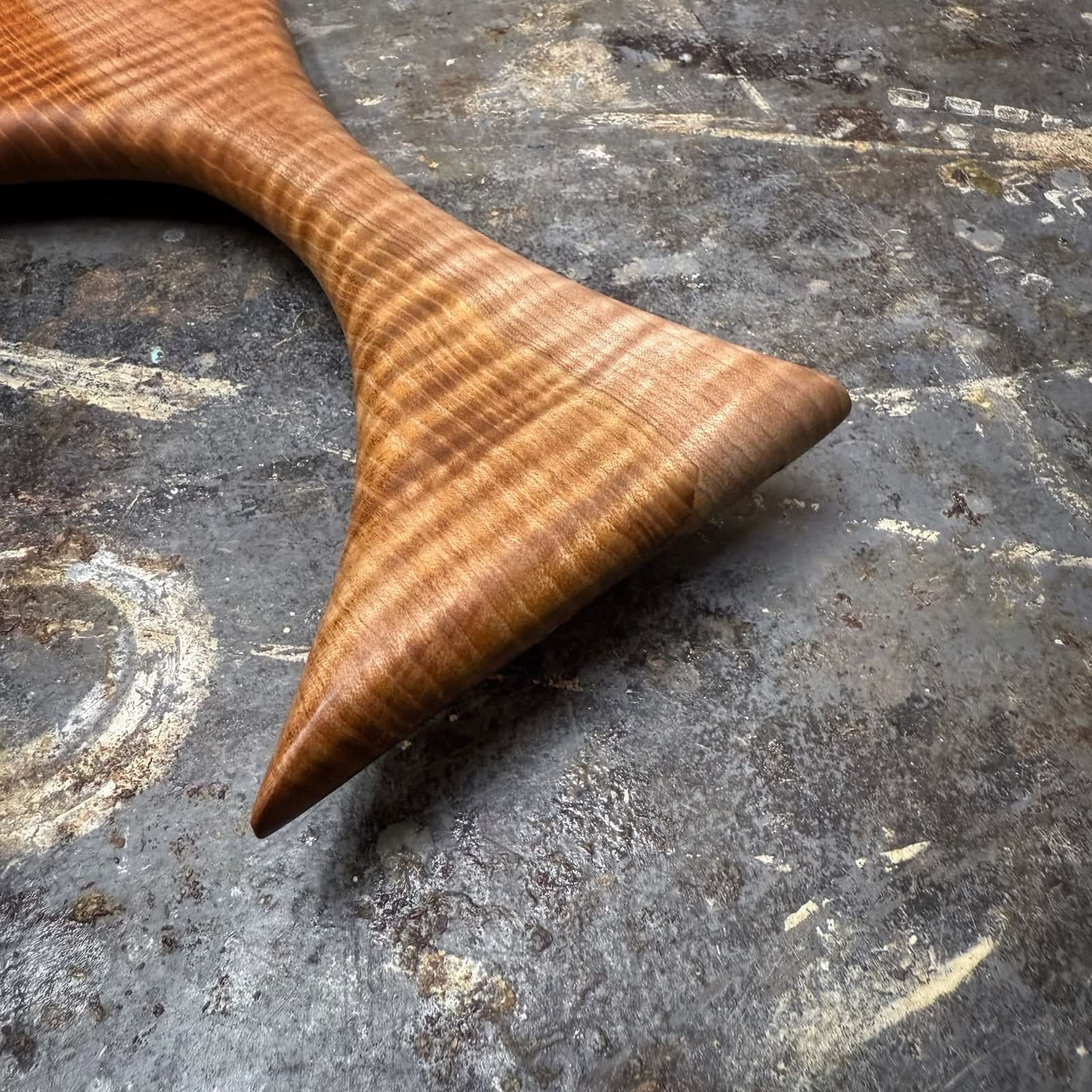 closeup of handle curvature and highly figured grain