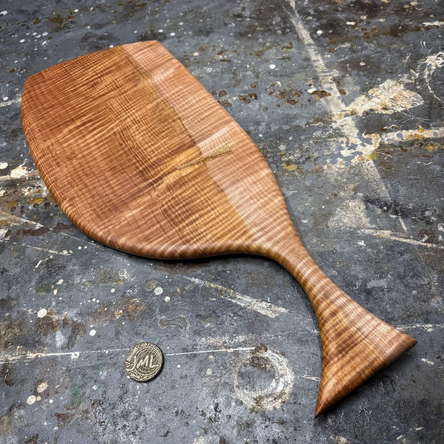 full board shot on workshop surface showing curl and contrast