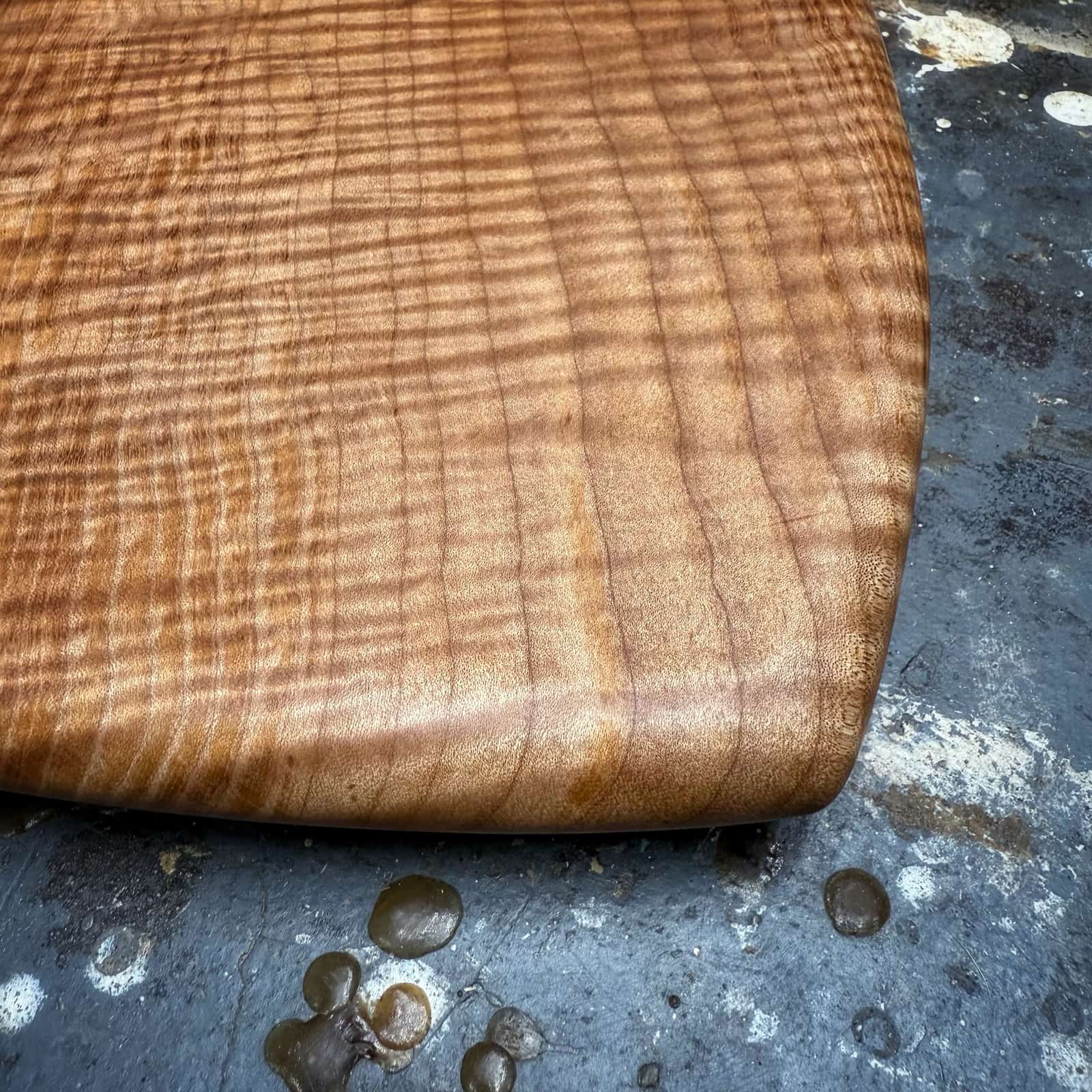 detailed closeup of curly maple figure and heartwood sapwood contrast