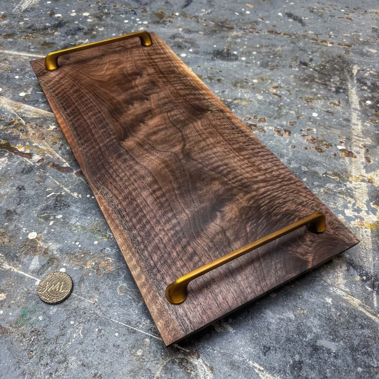 curly walnut serving tray with gold handles and sapwood edge accents