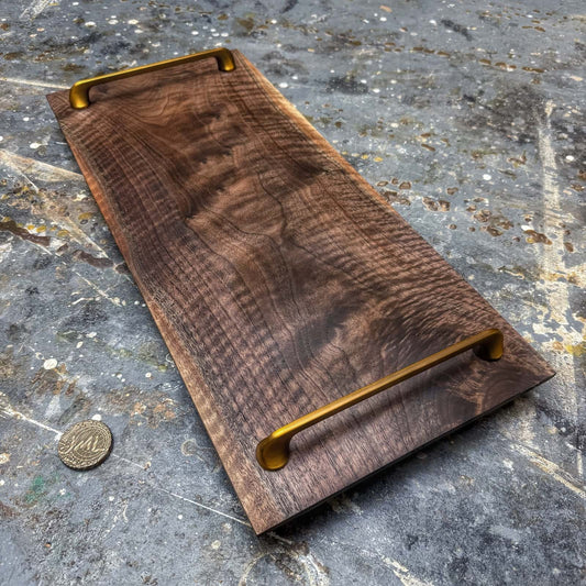 curly walnut serving tray with gold handles and sapwood edge accents