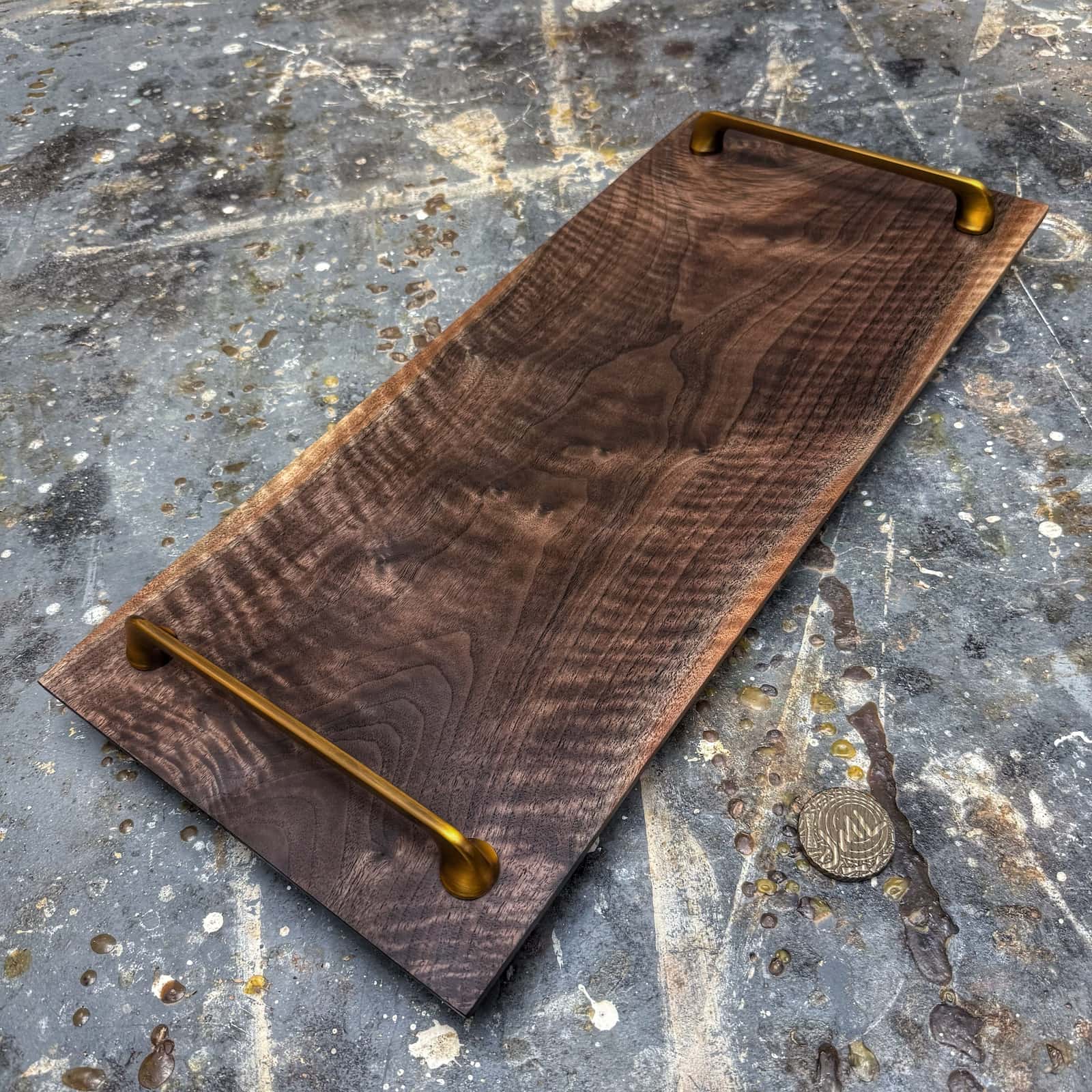 angled view showing beveled edges and brushed gold hardware