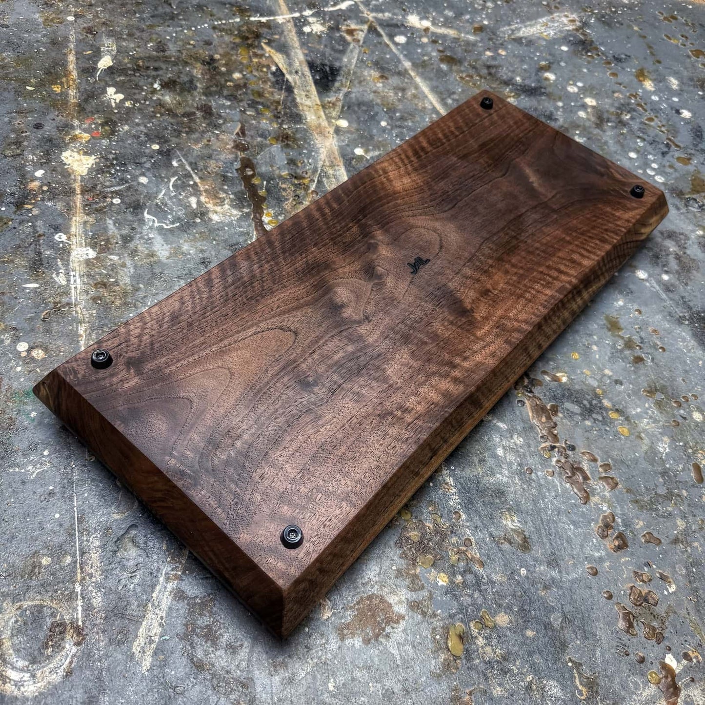 bottom view of curly walnut tray with gold handles