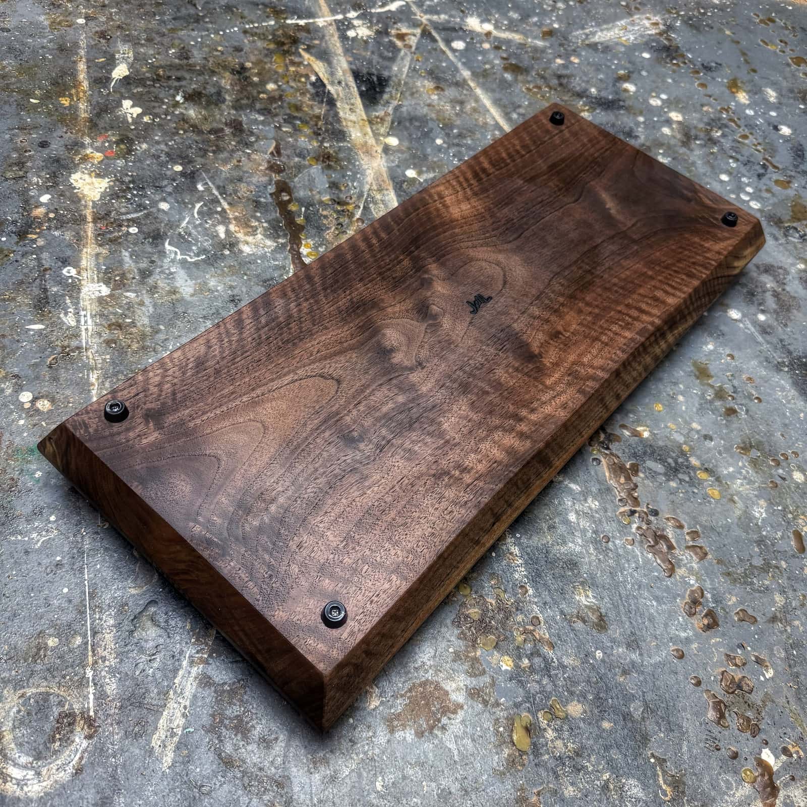 bottom view of curly walnut tray with gold handles