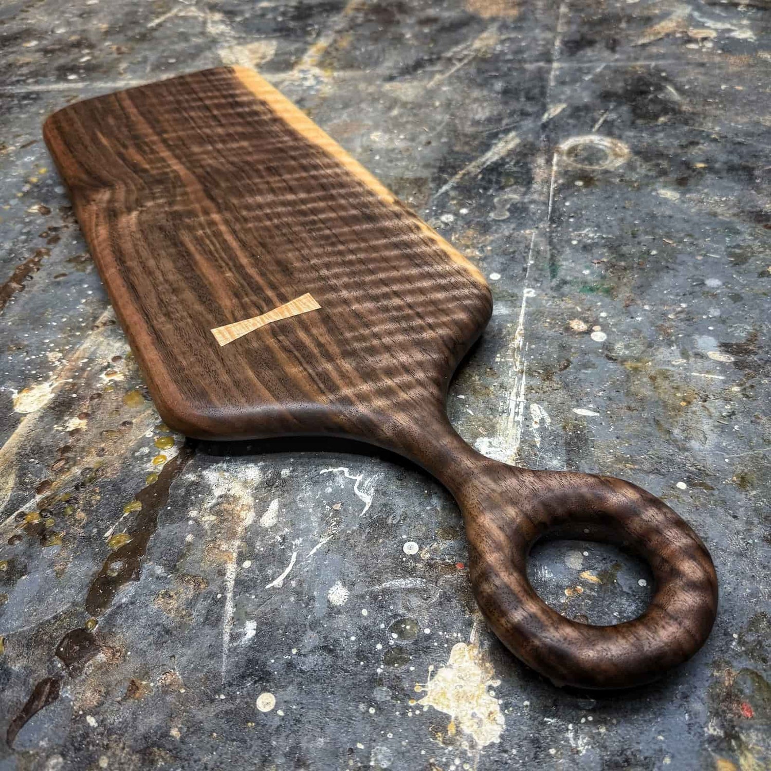 artisan crafted hardwood serving board featuring pronounced curl, warm tonal depth, and clean refined shaping by JML Woodcraft