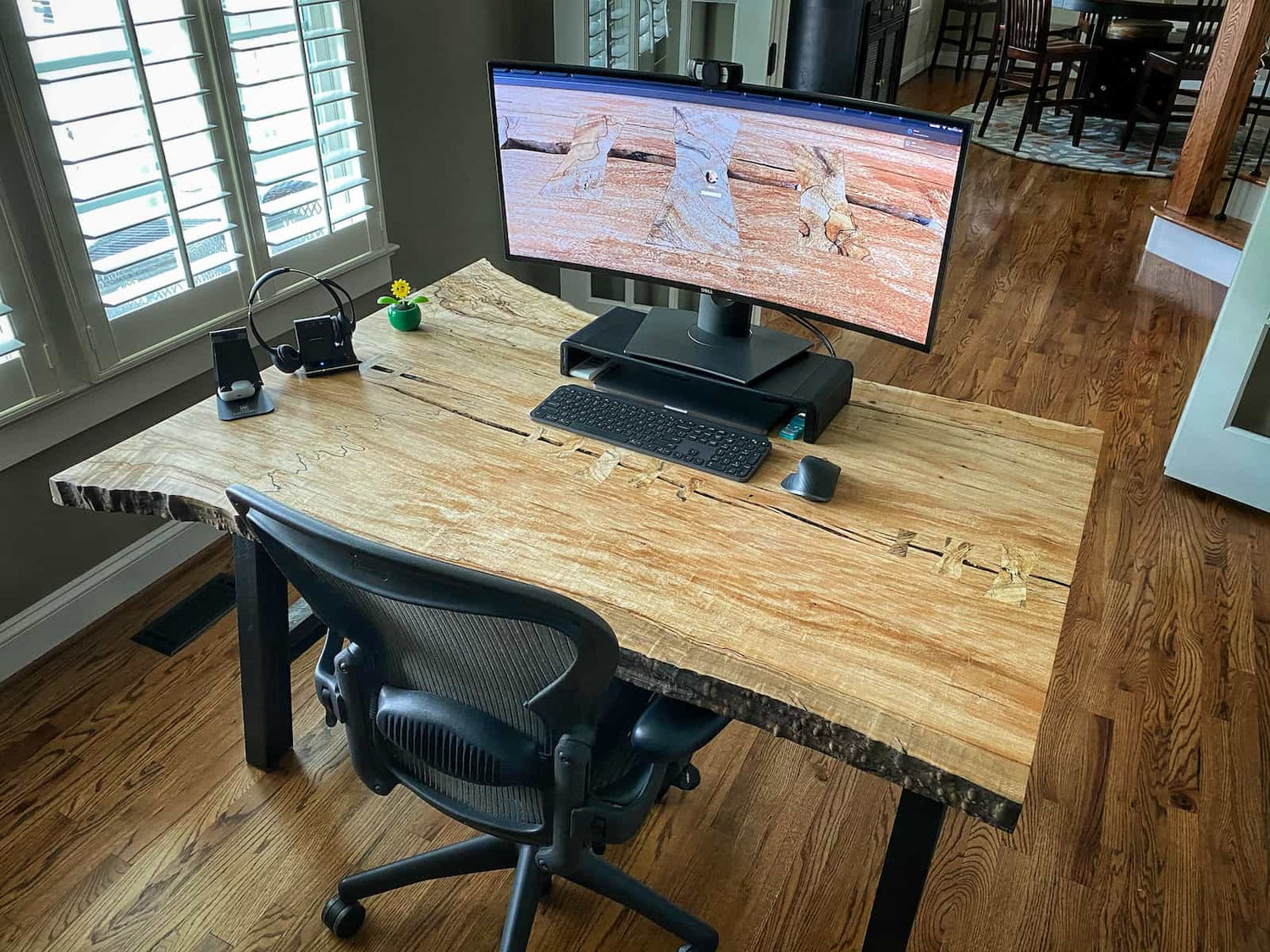 hand built hardwood desk with natural edge contours, bright figured detail, and a clean modern workspace design crafted by JML Woodcraft