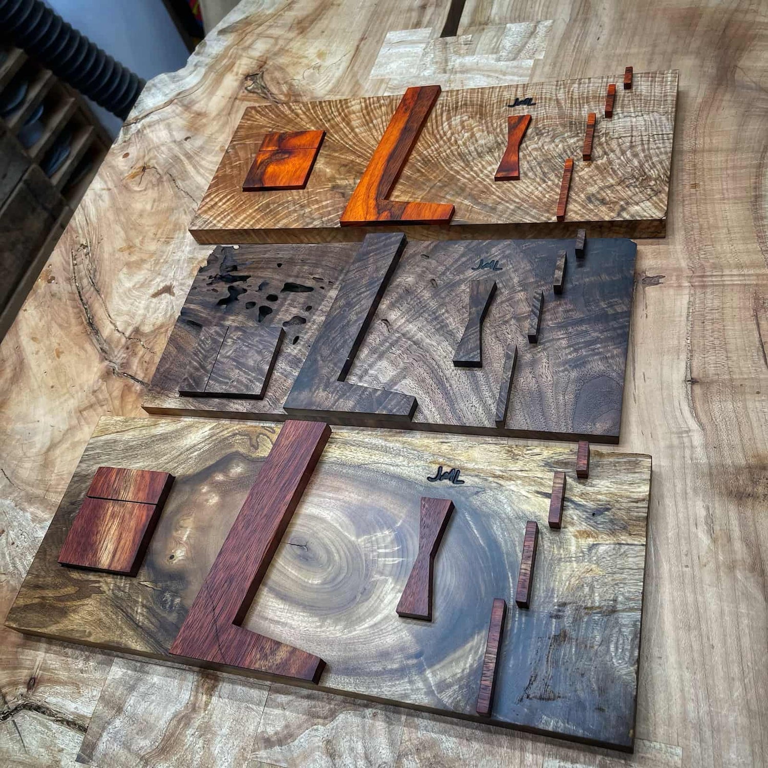 set of handcrafted hardwood inlay jigs featuring varied layouts, precise alignment slots, and clean functional design built by JML Woodcraft