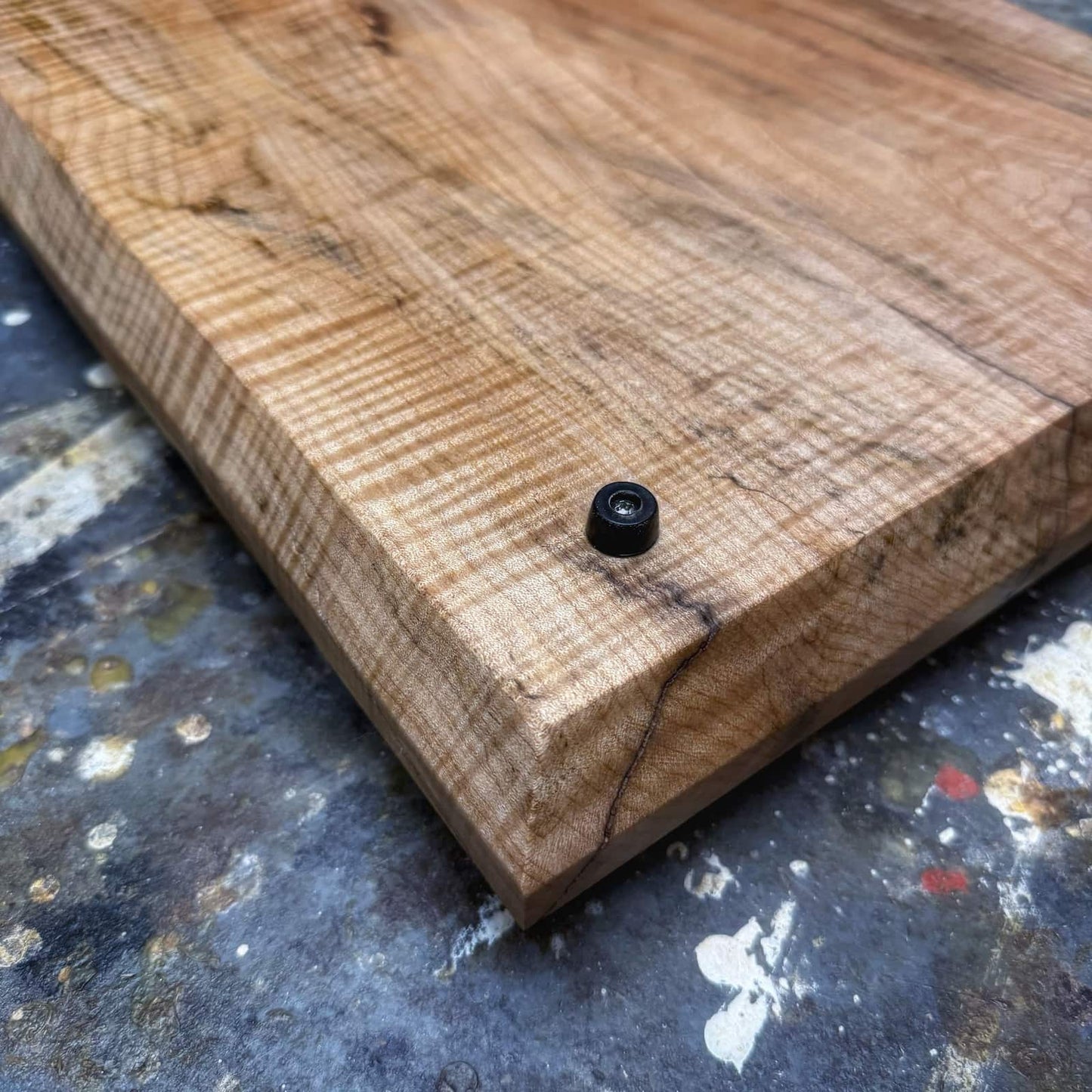 Gold handle curly maple tray with tapered sides and natural grain movement