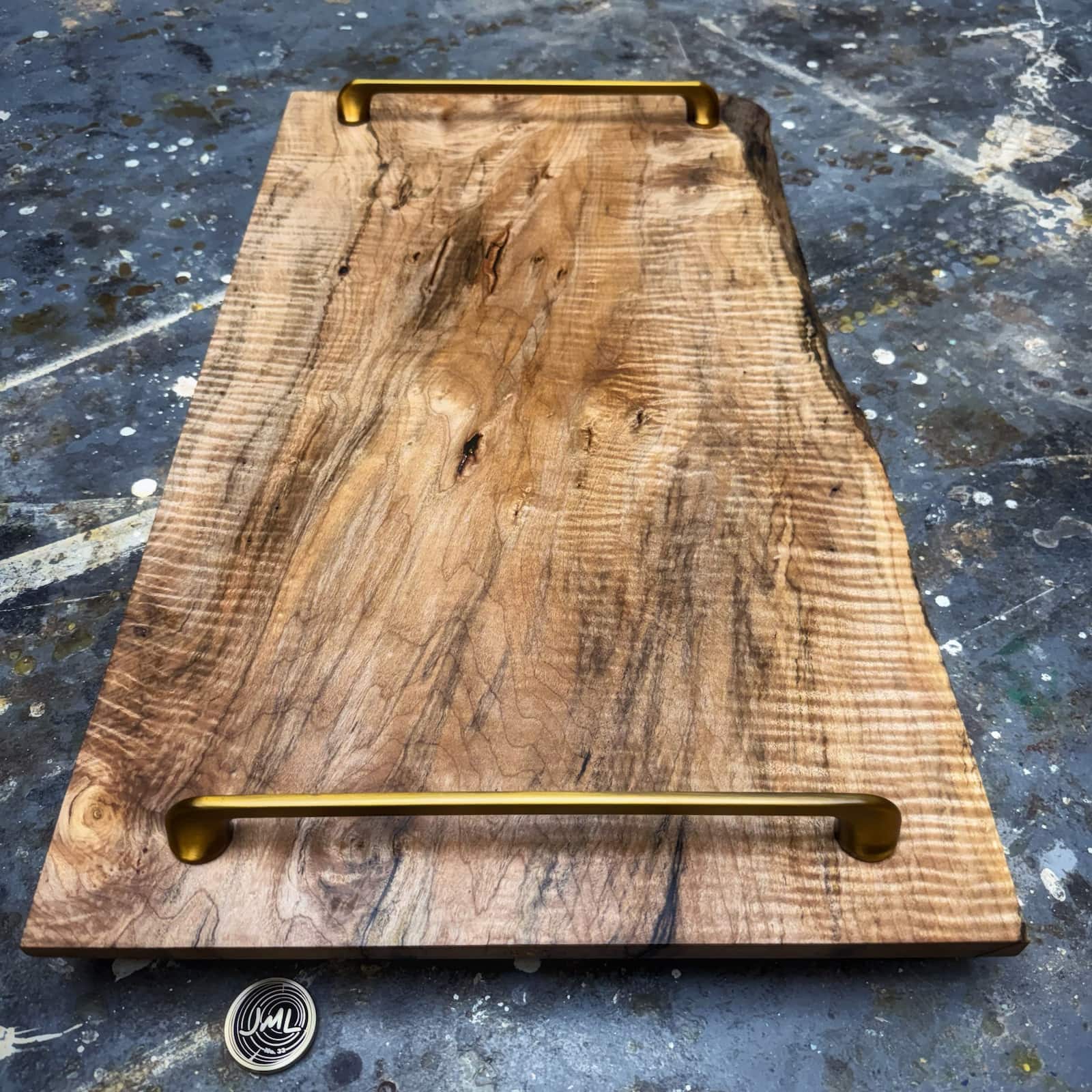 Curly maple serving tray with brushed brass handles and refined profile