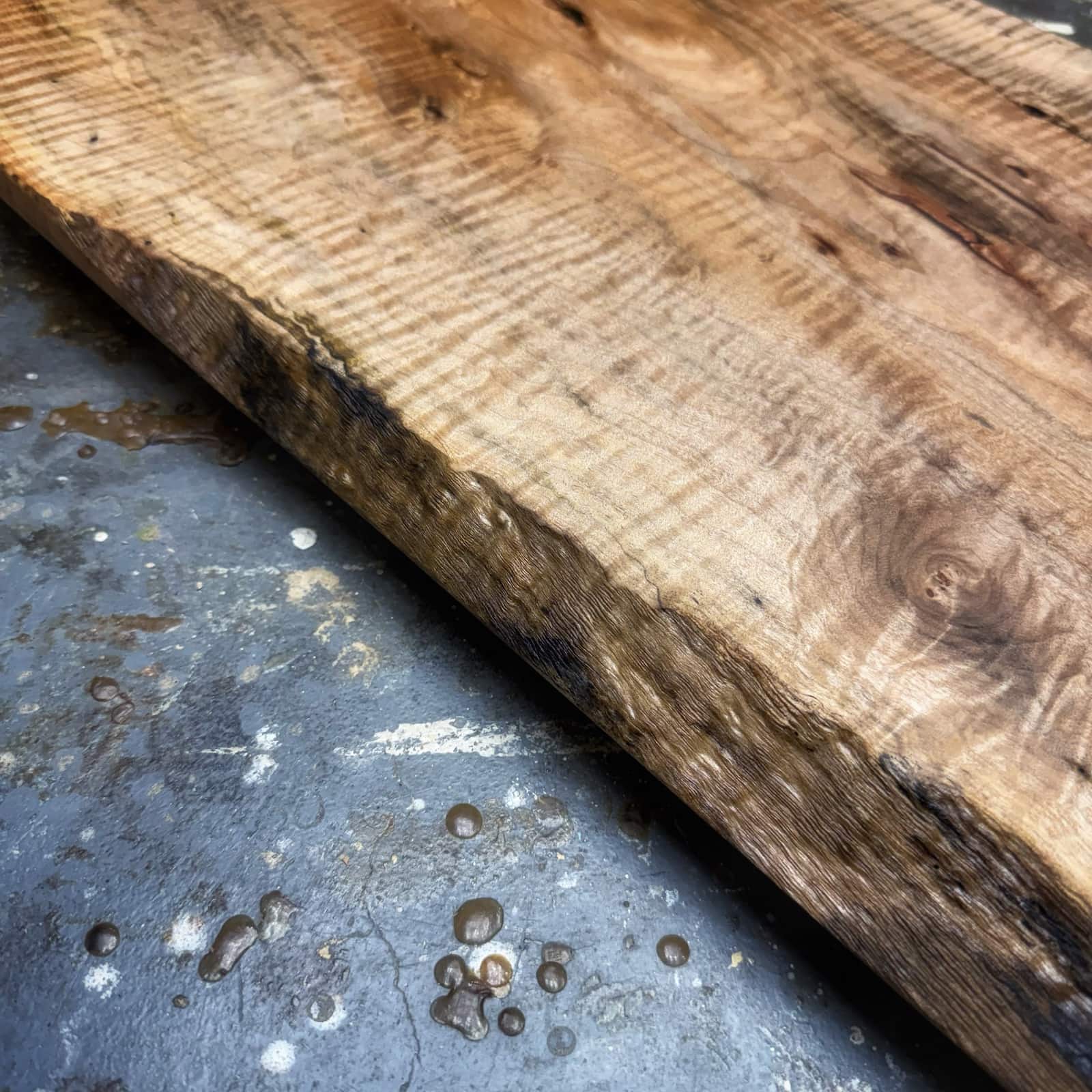 Close-up of curly maple grain and tapered edge on JML serving tray