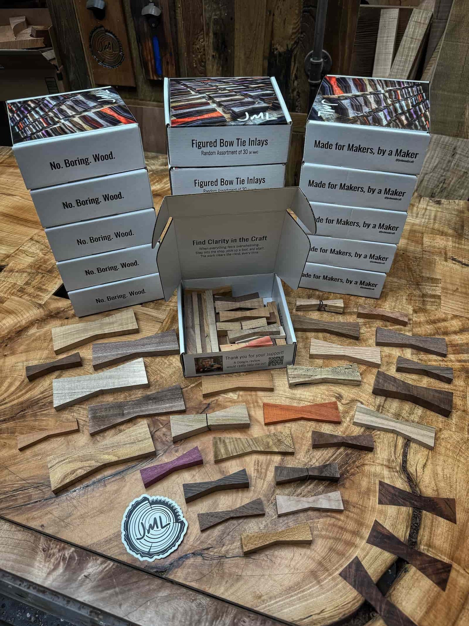 handcrafted hardwood inlay box filled with varied shapes, distinctive figure, and neatly organized pieces created by JML Woodcraft