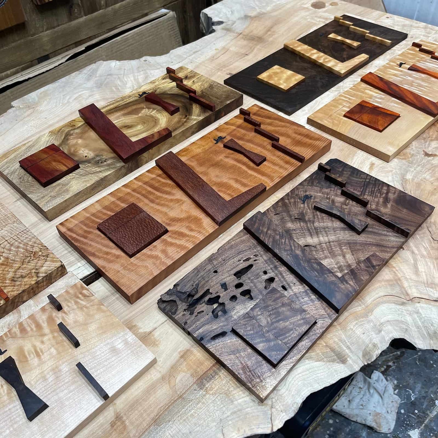 set of handcrafted hardwood inlay jigs displayed together showing varied sizes, natural figure, and clean functional detailing created by JML Woodcraft