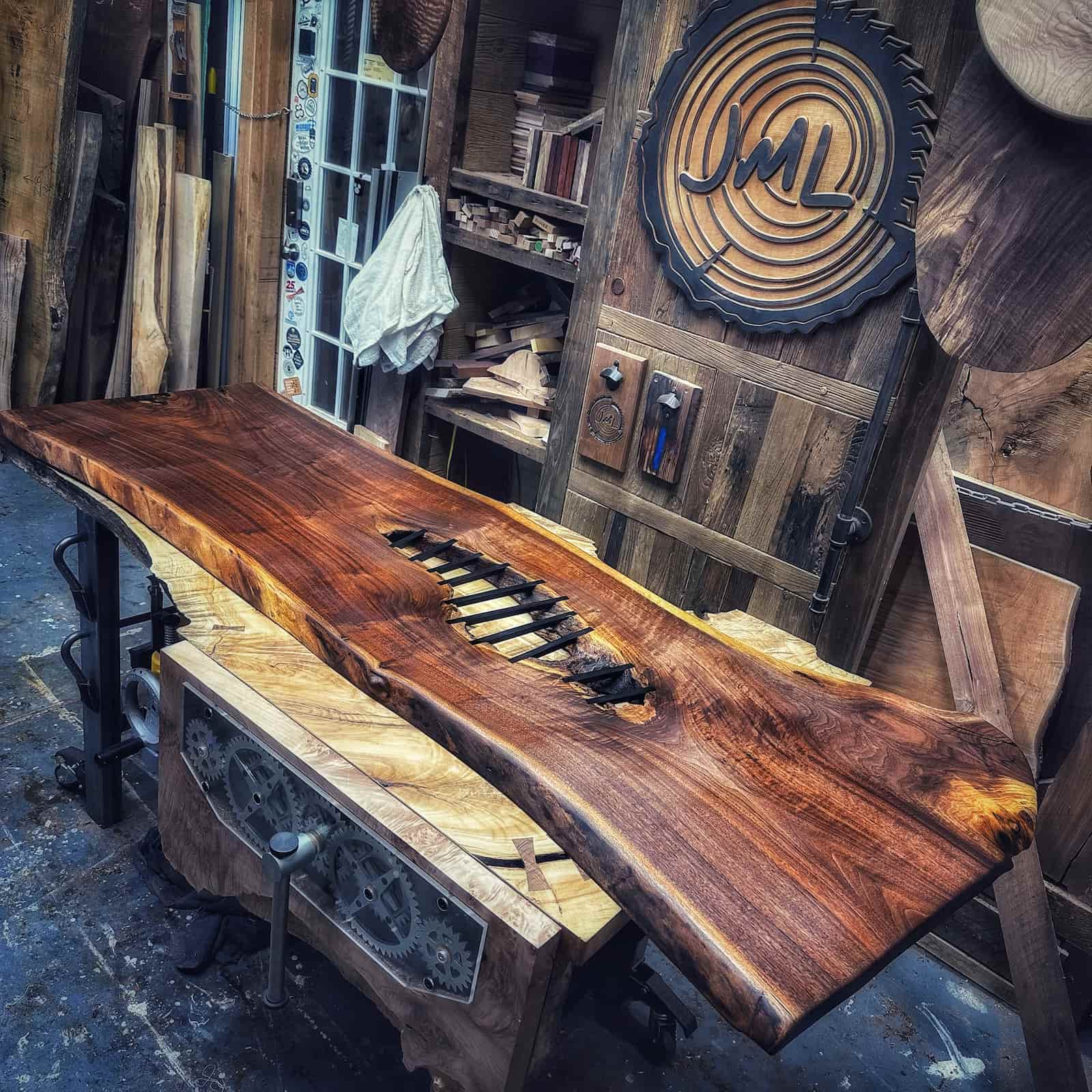 Walnut slab with hand-cut ebony bow tie stitches crafted from figured hardwood