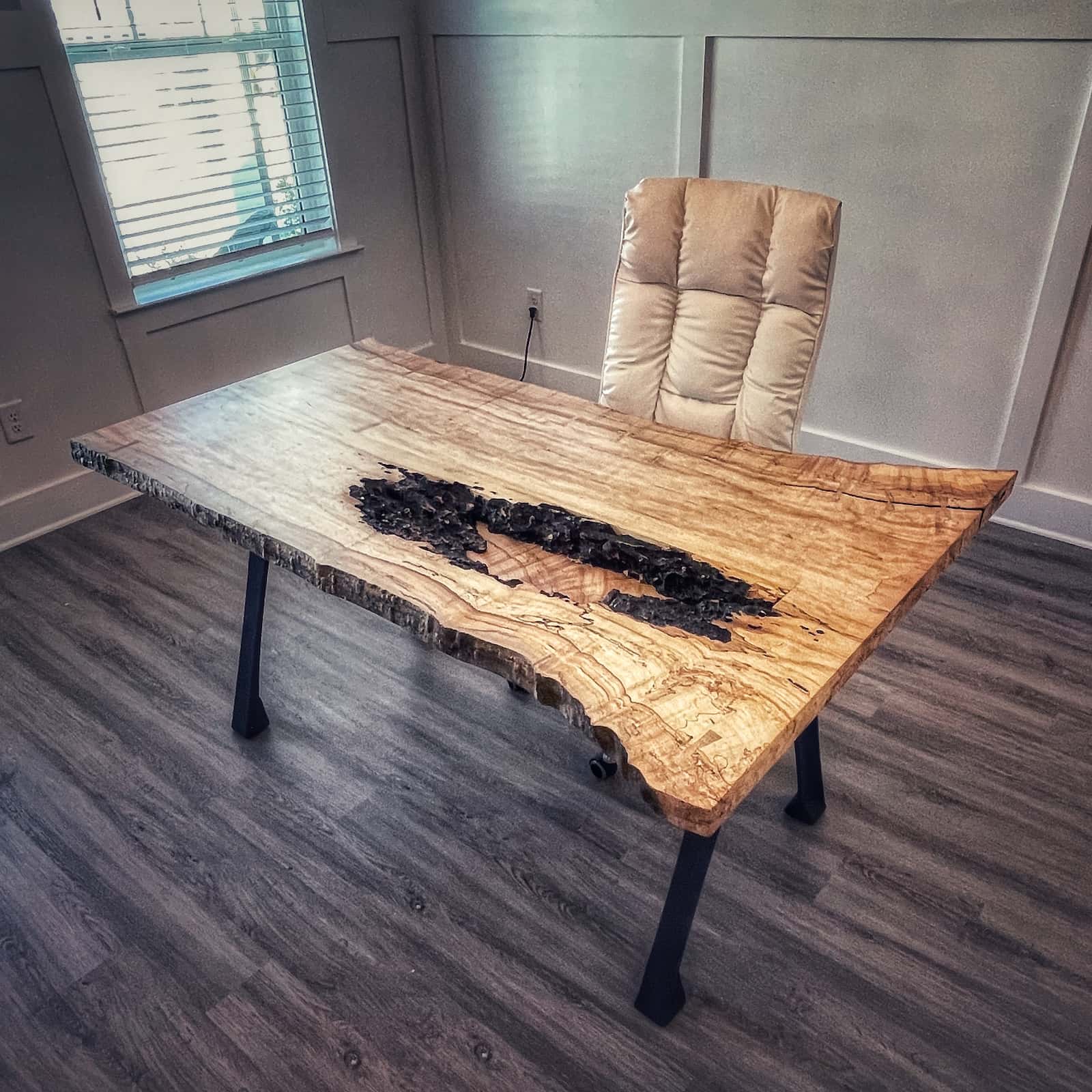handcrafted hardwood workspace with natural contours, bright figured detail, and a clean polished surface created by JML Woodcraft