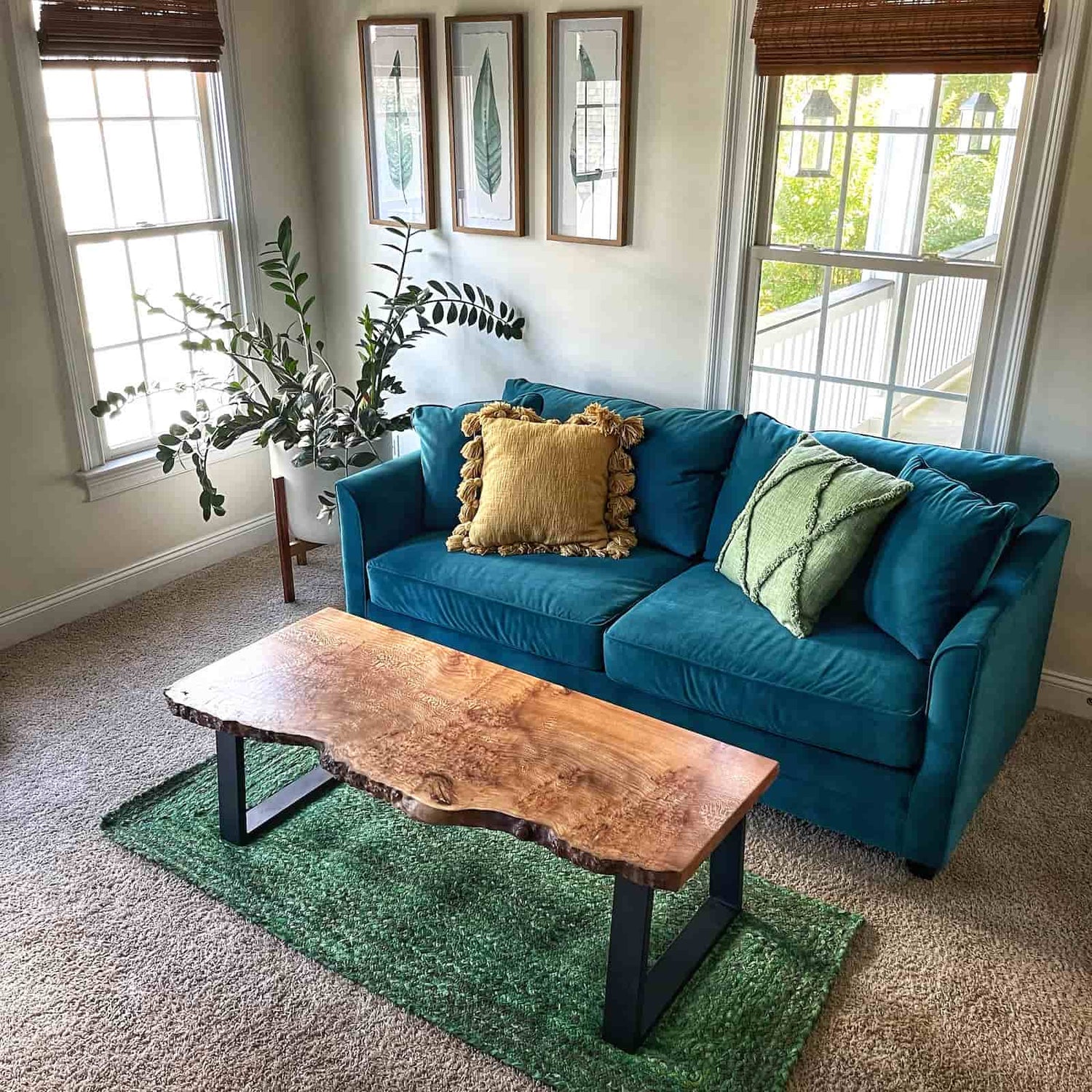 styled living room scene featuring a handcrafted hardwood coffee table with natural edge contours and warm inviting tone created by JML Woodcraft