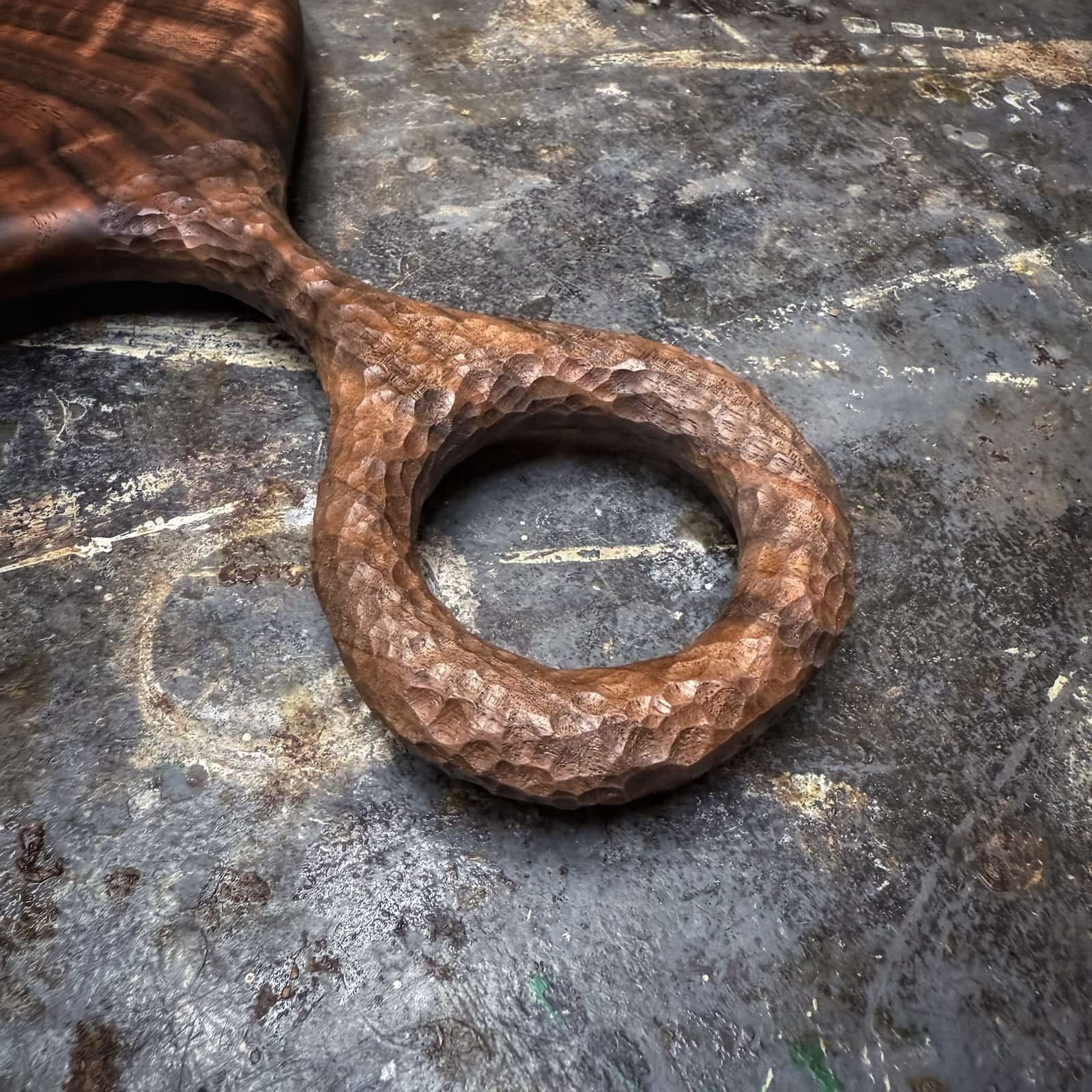 luxury walnut board with curly grain and hand-textured handle