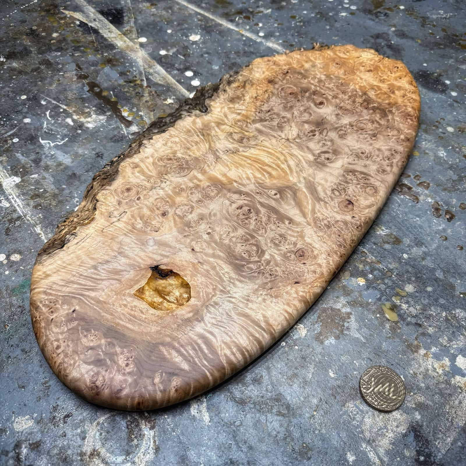 angled view highlighting live edge texture and smooth shaping