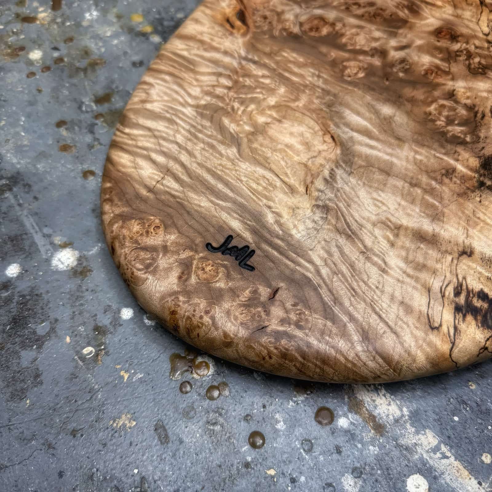 closeup of burl eye clusters and smooth finish in collector-grade maple