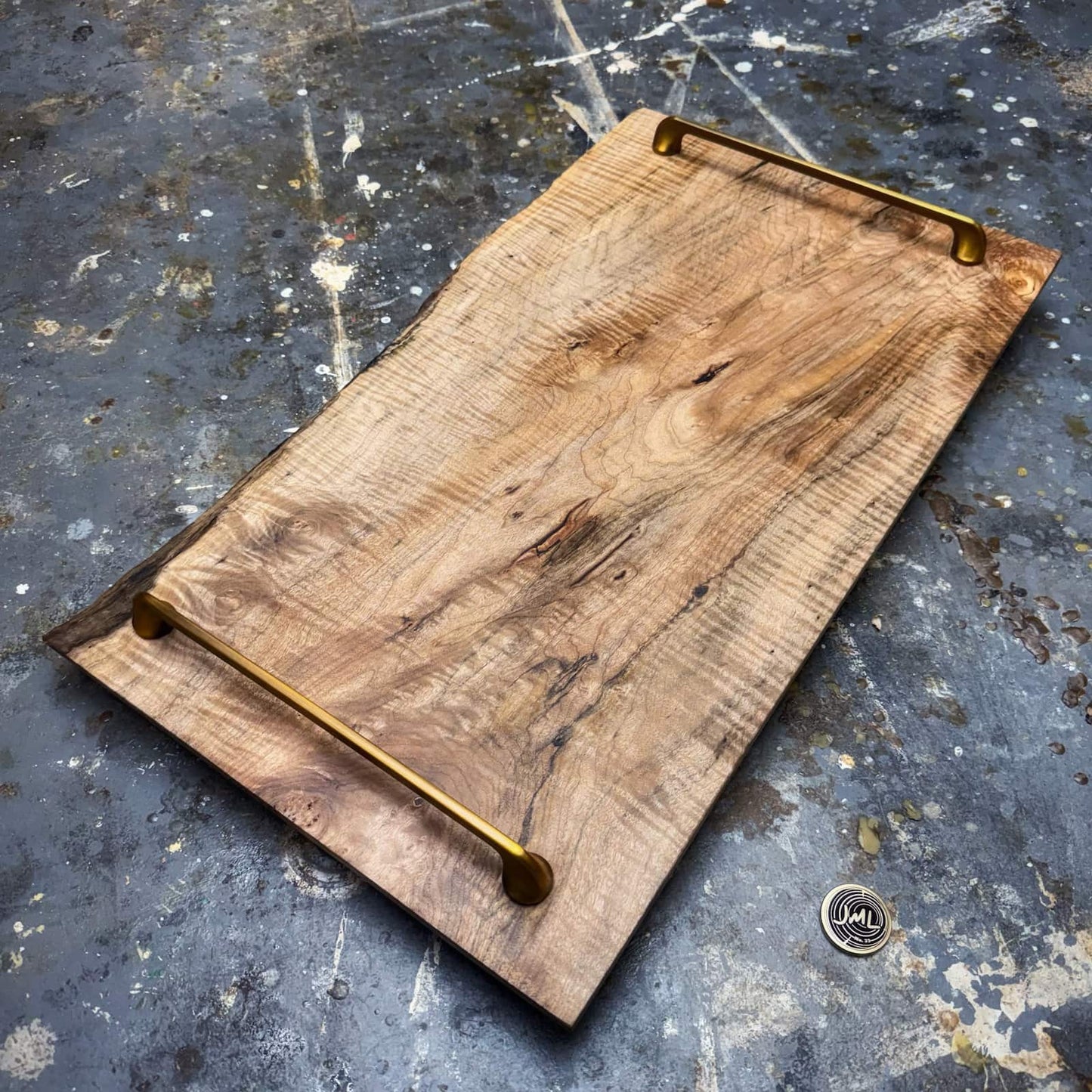 Handcrafted curly maple tray showing live edge section and figured grain