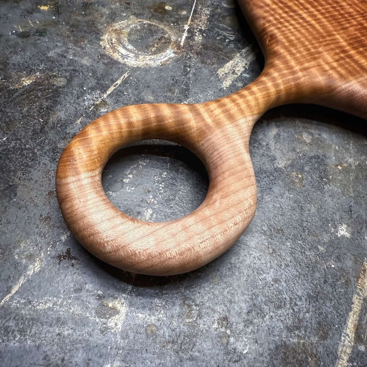 closeup of handle curvature and tight curl in maple